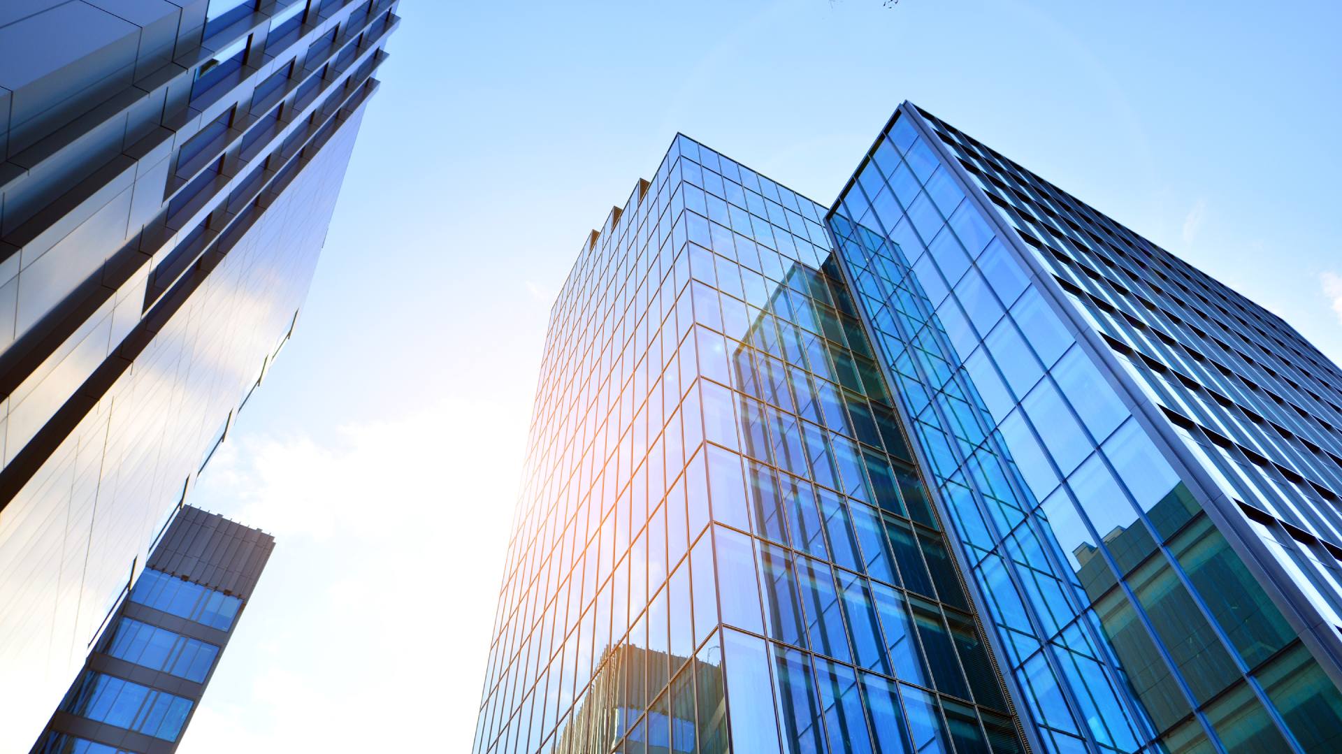 Modern glass building with sunlight reflection on the glass facade